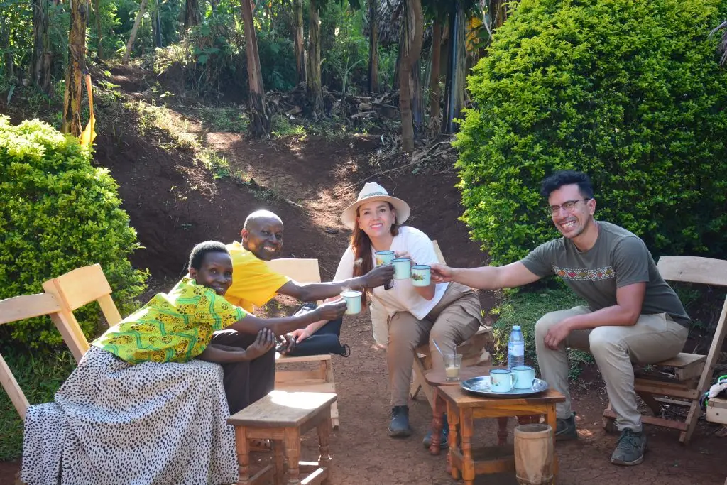 Visitors Enjoying freshly brewed Arabica coffee with local farmers during Coffee Tour in Sipi Falls