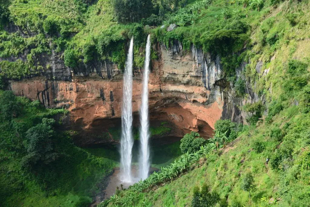 Chebonet waterfalls cascading down the ridge along the volccanic valley in Mount Elgon surrounded bhy lush green vegetation in Eastern Uganda