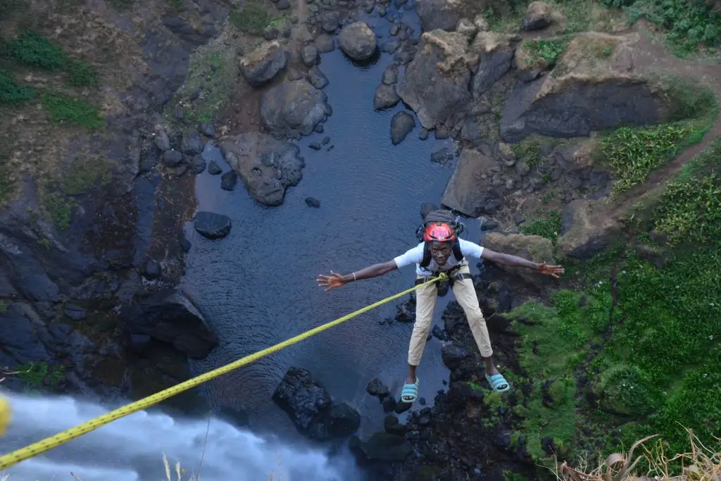 Abseiling at Sipi Falls in eastern Ugandawith safety rope and professional rock climbing instructors