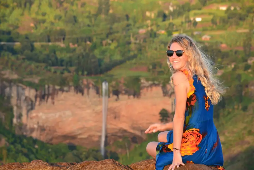 Traveler enjoying sipi falls sunset experience scenic views over the Sipi valley during a peaceful evening in Sipi Falls, eastern Uganda