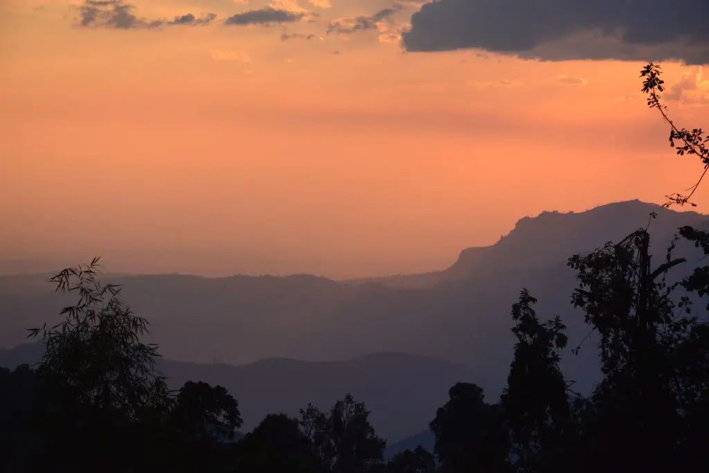 Scenic view along the Bushiyi Trail on Mount Elgon,showing forested slopes and layered mountain ranges seen during a trek