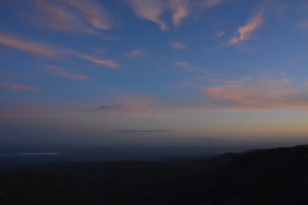 Sipi Falls Sunrise Experience overlooking Mount Elgon. Sunrise over the hills and the valleys of Sipi Falls and Colorful morning sky and Mount Elgon landscape in Uganda