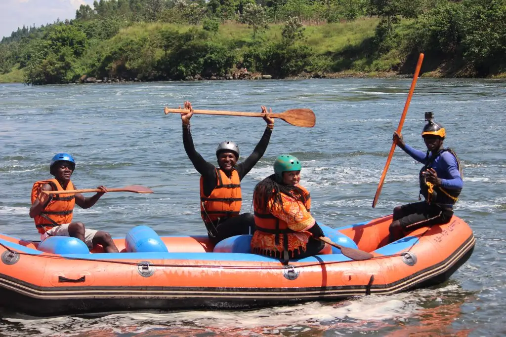 White water rafting on the Nile River in Jinja Uganda adventure tour Jinja adventure experience rafting on River Nile Tourists enjoying white water rafting in Jinja Uganda Nile River rafting with Discover Sipi Falls in Jinja