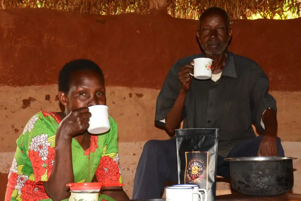 Coffee farmers enjoying coffee during coffee tour experience near Mount Elgon and kalenjin Coffee project.