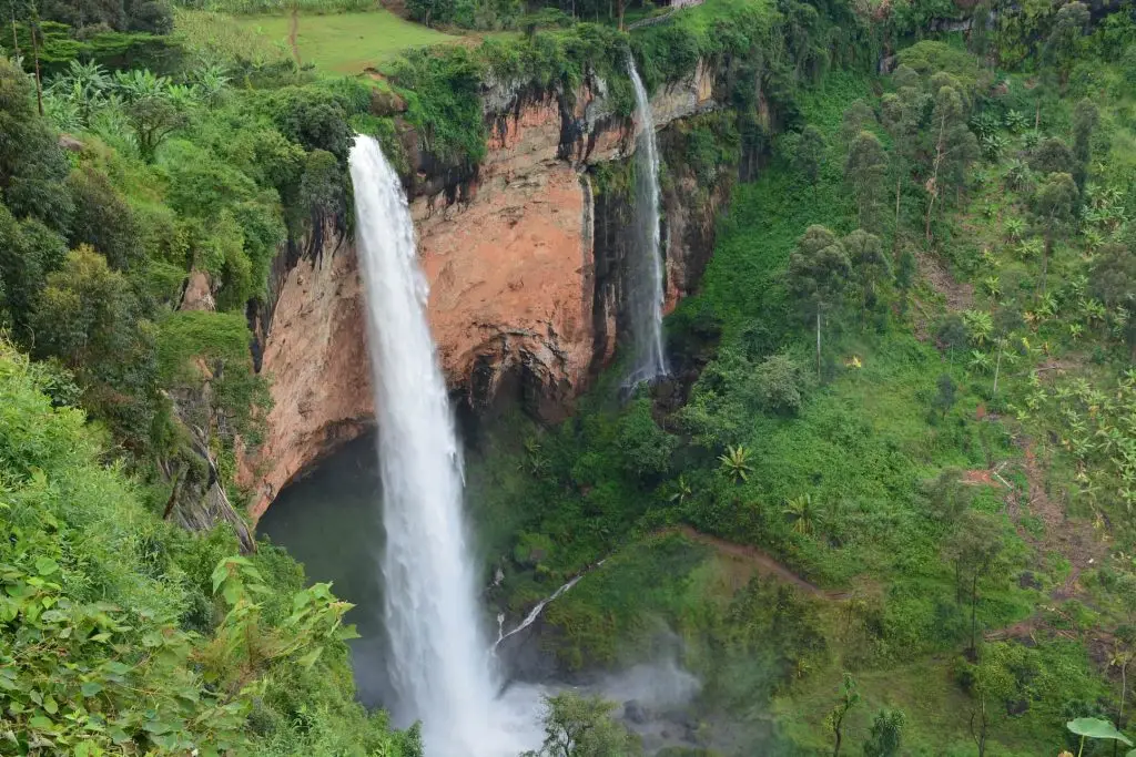 Sipi Falls hiking tour waterfall in Uganda with scenic green landscape